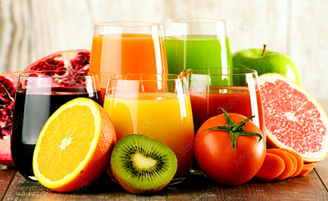 Various fruits and glasses of juice